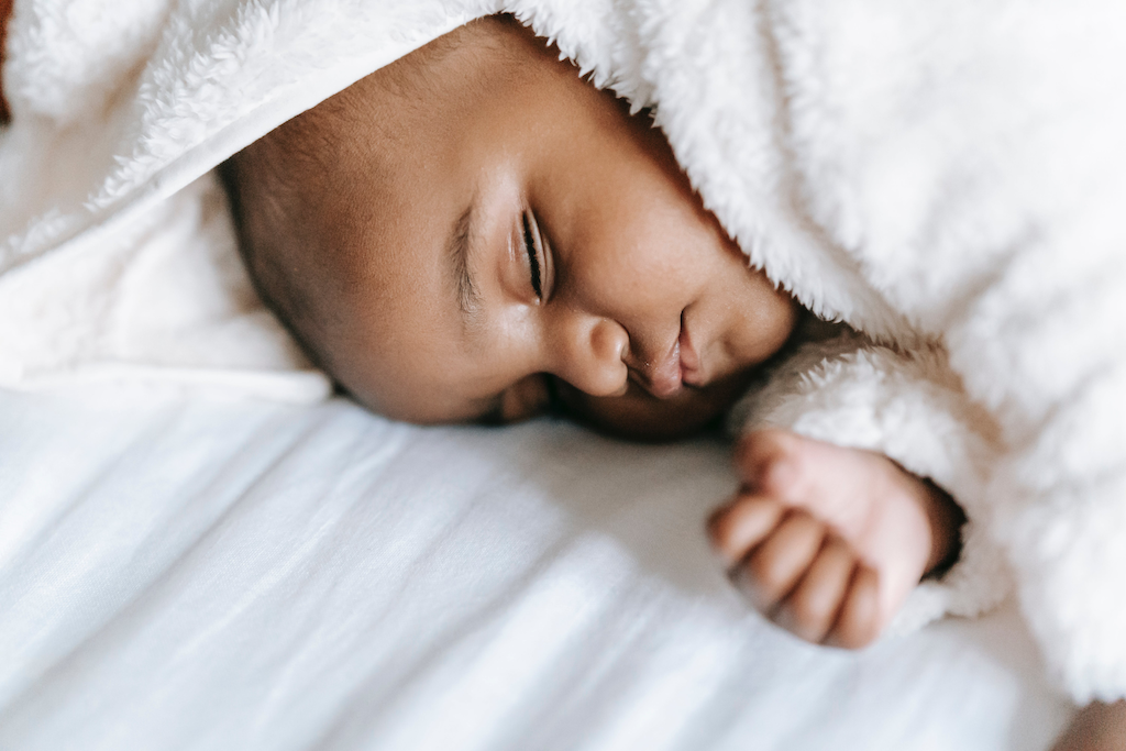 Sleeping newborn, representing a certified copy of an Alameda County birth certificate