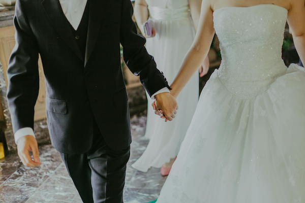 Bridge and groom holding hands, symbolizing a certified copy of a marriage certificate from San Mateo County.